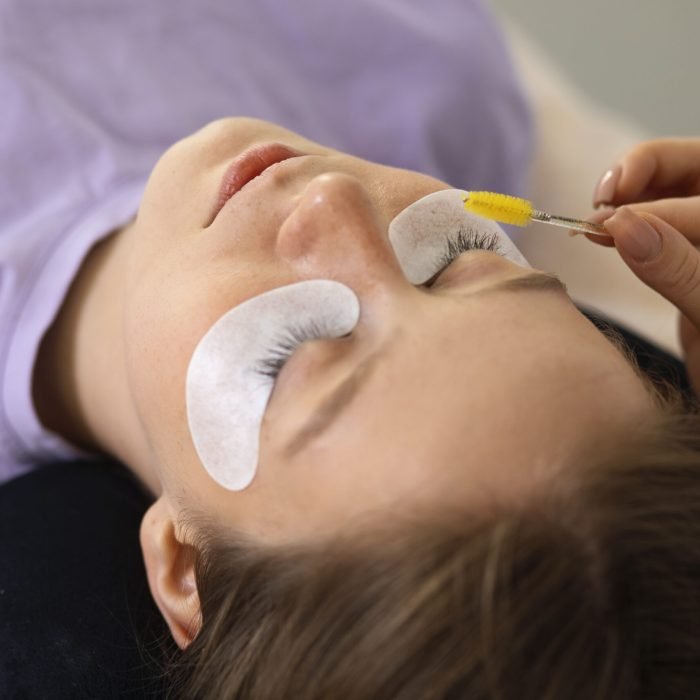 woman-wearing-eye-patches-high-angle